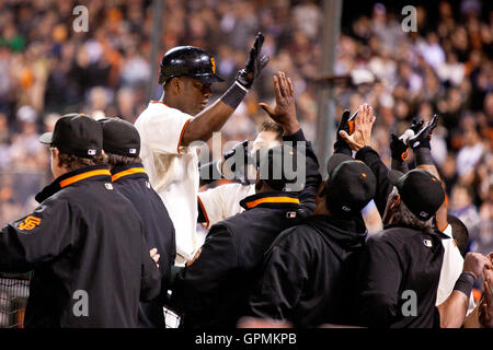 July 27, 2010; San Francisco, CA, USA;  San Francisco Giants shortstop Edgar Renteria (16) is congratulated by teammates after hitting a two run home run off of Florida Marlins relief pitcher Brian Sanches (not pictured) during the eighth inning at AT&T P Stock Photo