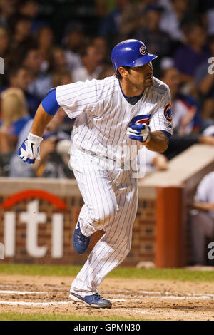 August 17, 2010; Chicago, IL, USA; Chicago Cubs right fielder Xavier Nady (22) hits a double against the San Diego Padres during the fourth inning at Wrigley Field. Stock Photo