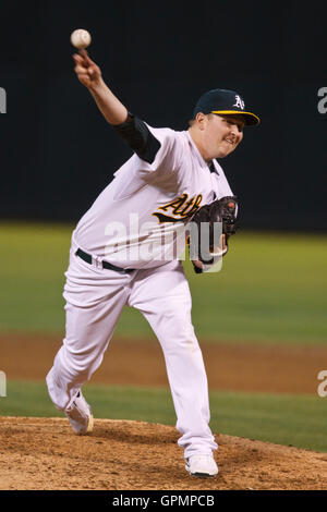 September 21, 2010; Oakland, CA, USA;  Oakland Athletics starting pitcher Trevor Cahill (53) pitches against the Chicago White Sox during the third inning at Oakland-Alameda County Coliseum. Stock Photo