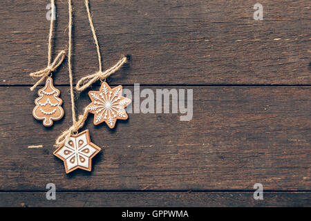 christmas decoration hanging on wood background with copyspace. Stock Photo