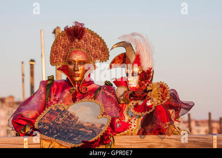 A couple dressed with classic costume posing in Venice during the carnival. Stock Photo