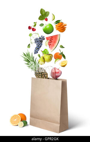 Fruits falling into bag isolated on white Stock Photo