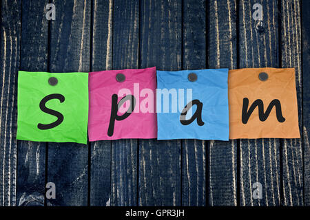 Spam message post on wooden wall close-up Stock Photo