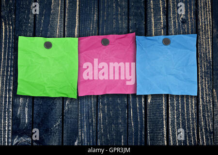 Empty notes post on wooden wall close-up Stock Photo