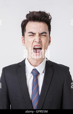 Portrait of young angry businessman Stock Photo