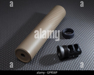 Suppressor and the adapter that holds it on the barrel of a rifle Stock ...