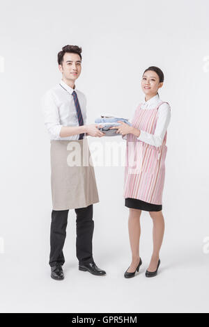 Loving harmonious young couple doing chores Stock Photo