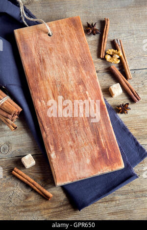 Empty rustic wooden cutting board with baking ingredients, homemade bakery. Stock Photo