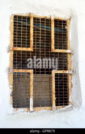 Railing of window in the shape of iron cross. Stock Photo