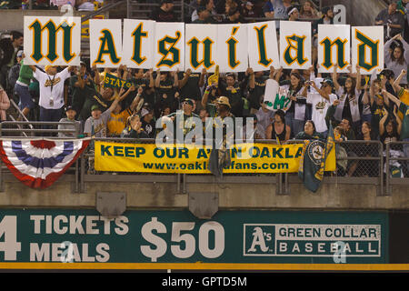 Seattle Mariners fans hold up signs mocking Canada during a baseball game  between the Mariners and the Toronto Blue Jays, Friday, July 8, 2022, in  Seattle. The sign on the left refers