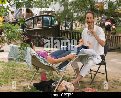Foot massage at Boulder's Central Park near Boulder Creek Stock Photo