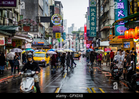 Narrow street on a rainy day in the Da’an District, in Taipei, Taiwan. Stock Photo