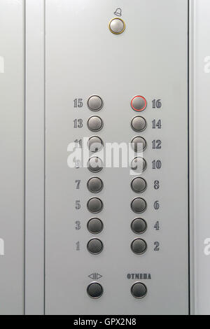 Metal elevator control panel with round buttons with numbers of floors Stock Photo