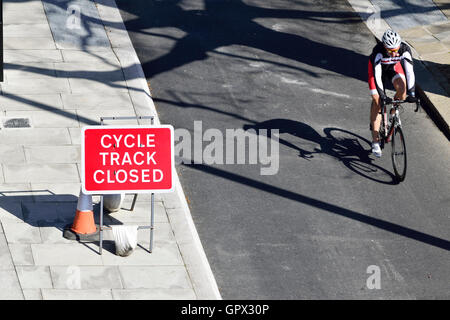 London, England, UK. Cycle Track Closed sign on the Victoria Embankment. People cycling past Stock Photo