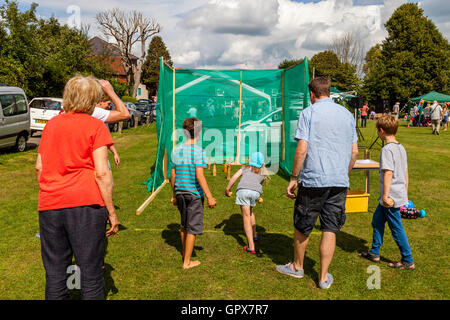 Families Playing Skittles At The Annual Alfriston Village Fete, Alfriston, East Sussex, UK Stock Photo