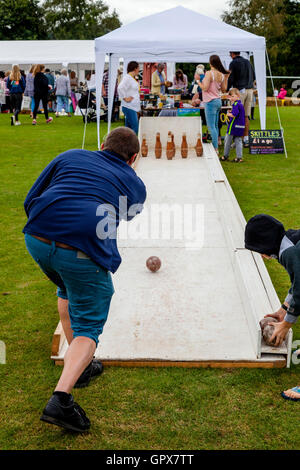 People Playing Skittles At The Annual Hartfield Village Fete, Alfriston, East Sussex, UK Stock Photo