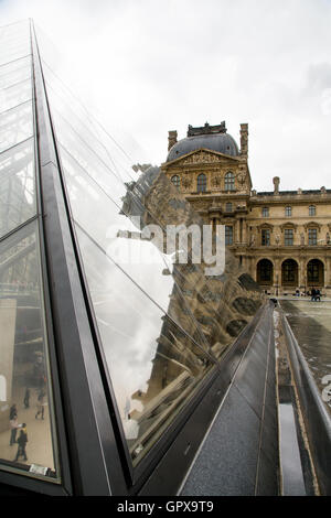 Famous Louvre Museum Pyramid made of glass in Paris, France Stock Photo