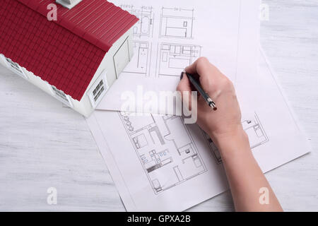 3d renderer image. A house with house plan and tools. Architecture Concept. Stock Photo