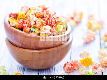 color popcorn in bowls and on a table Stock Photo