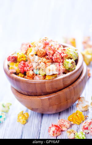 color popcorn in bowls and on a table Stock Photo