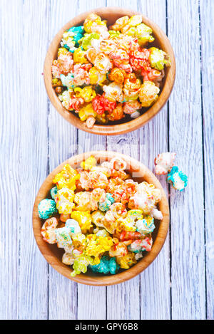 color popcorn in bowls and on a table Stock Photo