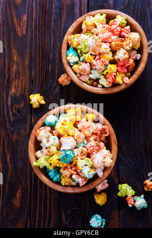 color popcorn in bowls and on a table Stock Photo
