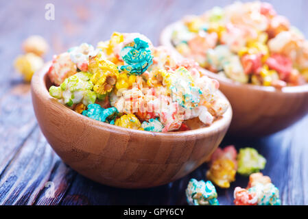 color popcorn in bowls and on a table Stock Photo