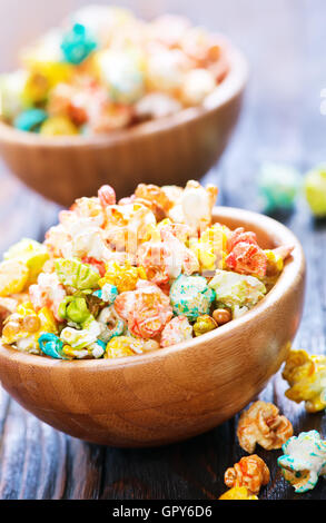 color popcorn in bowls and on a table Stock Photo