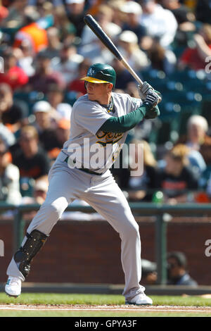 May 21, 2011; San Francisco, CA, USA;  Oakland Athletics left fielder Ryan Sweeney (15) at bat against the San Francisco Giants during the first inning at AT&T Park.  San Francisco defeated Oakland 3-0. Stock Photo