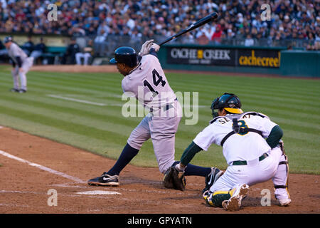 May 31, 2011; Oakland, CA, USA;  New York Yankees center fielder Curtis Granderson (14) hits a 2 RBI single against the Oakland Athletics during the fourth inning at Oakland-Alameda County Coliseum. Stock Photo
