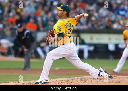 June 18, 2011; Oakland, CA, USA;  Oakland Athletics starting pitcher Guillermo Moscoso (52) pitches against the San Francisco Giants during the second inning at O.co Coliseum. Stock Photo