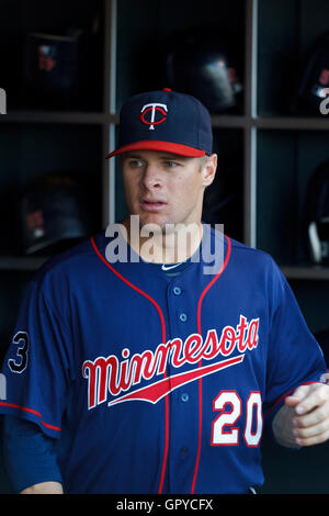 June 21, 2011; San Francisco, CA, USA;  Minnesota Twins shortstop Matt Tolbert (20) stands in the dugout before the game against the San Francisco Giants at AT&T Park. Minnesota defeated San Francisco 9-2. Stock Photo