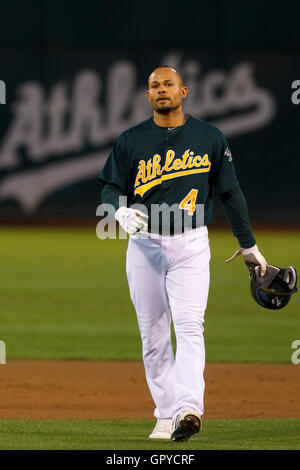 June 28, 2011; Oakland, CA, USA; Oakland Athletics center fielder Coco Crisp (4) returns to the dugout after the first inning against the Florida Marlins at the O.co Coliseum.  Oakland defeated Florida 1-0. Stock Photo