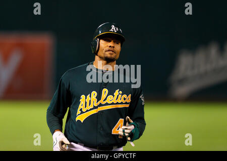 June 28, 2011; Oakland, CA, USA; Oakland Athletics center fielder Coco Crisp (4) returns to the dugout after the sixth inning against the Florida Marlins at the O.co Coliseum.  Oakland defeated Florida 1-0. Stock Photo