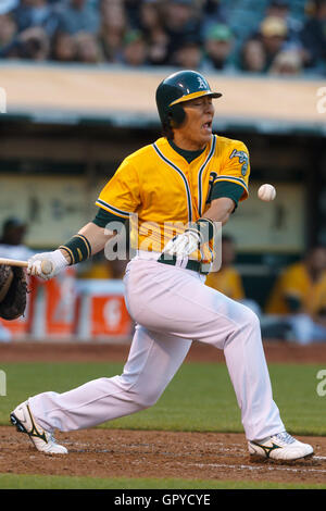 June 29, 2011; Oakland, CA, USA; Oakland Athletics designated hitter Hideki Matsui (55) reacts after hitting a foul ball off his foot against the Florida Marlins during the third inning at the O.co Coliseum. Stock Photo