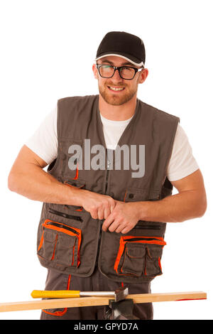 Clumsy carpenter punches finger while hammering nail with hammer isolated over white. Stock Photo