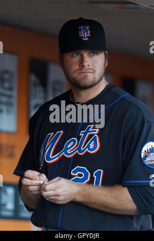 July 8, 2011; San Francisco, CA, USA;  New York Mets first baseman Lucas Duda (21) stands in the dugout before the game against the San Francisco Giants at AT&T Park. New York defeated San Francisco 5-2. Stock Photo