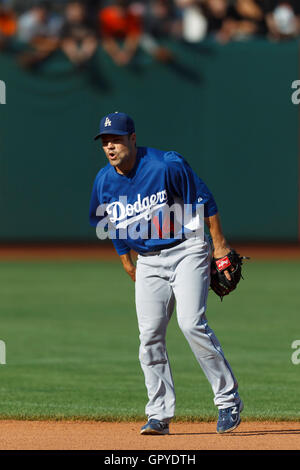 July 18, 2011; San Francisco, CA, USA;  Los Angeles Dodgers shortstop Jamey Carroll (14) warms up before the game against the San Francisco Giants at AT&T Park. San Francisco defeated Los Angeles 5-0. Stock Photo