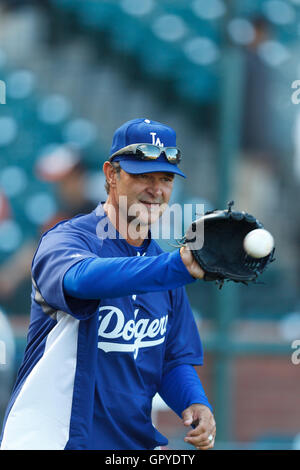 July 18, 2011; San Francisco, CA, USA;  Los Angeles Dodgers manager Don Mattingly (8) plays catch during batting practice before the game against the San Francisco Giants at AT&T Park. Stock Photo