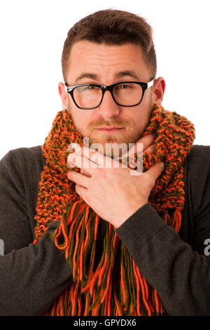 Man with flu and fever wrapped in scarf has terrible sore throat isolated over white. Stock Photo