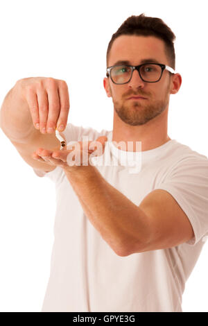 Man breaking cigarette as a gesture of quitting smoking isolated over white. Stock Photo