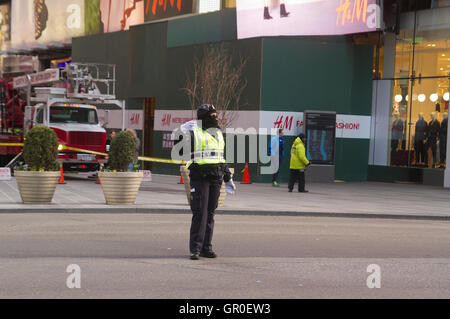 NYPD directing traffic in New York city in winter Stock Photo