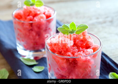 Strawberry granita with mint (frozen dessert) in portion glasses close up Stock Photo