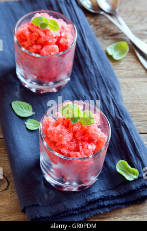 Strawberry granita with mint (frozen dessert) in portion glasses close up Stock Photo