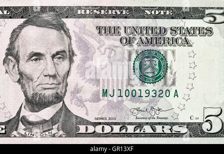 Portrait of the US President Abraham Lincoln on five dollar banknote bill, front side obverse. Stock Photo