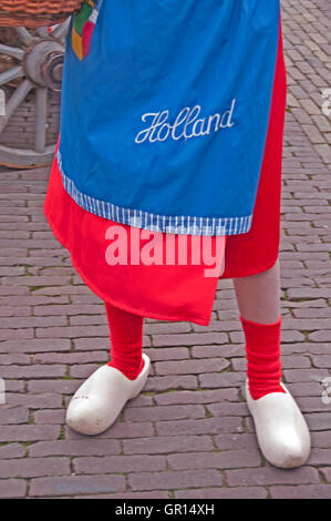 A costumed local girl sells samples of cheese at the Alkmaaar Cheese Market, Holland Stock Photo