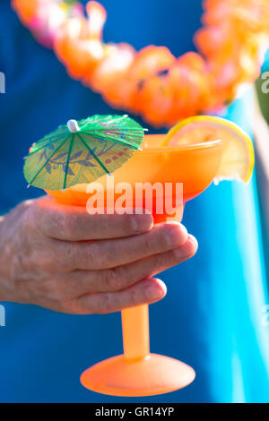 Man Enjoying Tropical Drink Stock Photo