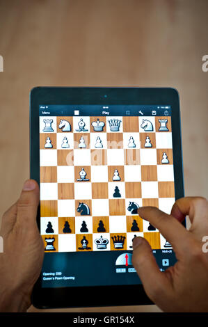 playing a chess game on iPad tablet Stock Photo