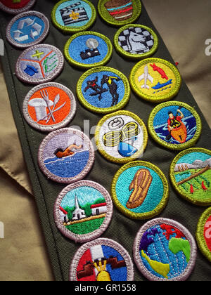 Boy scout in uniform with sash of badges Stock Photo - Alamy