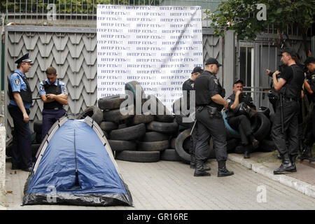August 2, 2016 - Kiev, Ukraine - Police stand guard next to a fence of  the TV channel ''Inter'' building  during a protest of activists in Kiev, Ukraine,on 05 September,2016.Protesters, who accused one of the biggest Ukrainian TV channel  ''Inter'' of a pro-Russian position and working for the Kremlin, blocked the channel's central office building and the studios. (Credit Image: © Serg Glovny via ZUMA Wire) Stock Photo